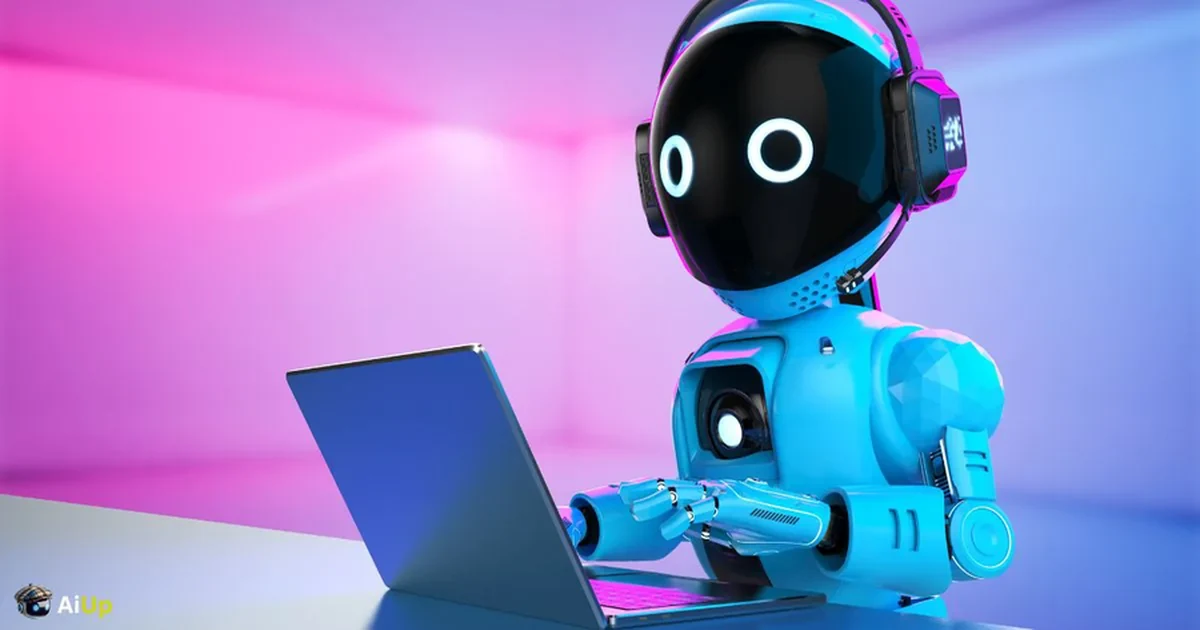 A small robot wearing a headset, working at a laptop